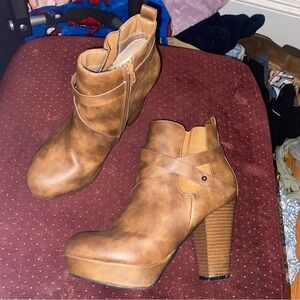 Dominique Nicole faux leather ankle boots with a block heel and strap accents